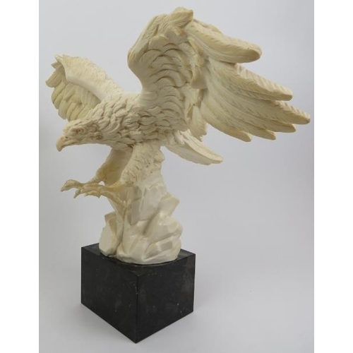 55 - A composite cast statue of an eagle, 20th century. Signed to the reverse and displayed on a marble p... 