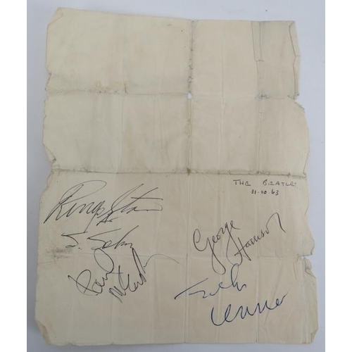 62 - The Beatles: A page signed by all four members of the band in 1963. Clearly signed in black and blue... 