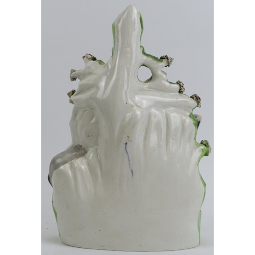 69 - An ecclesiastical Staffordshire pottery flat backed figural spill vase, 19th century. Modelled depic... 