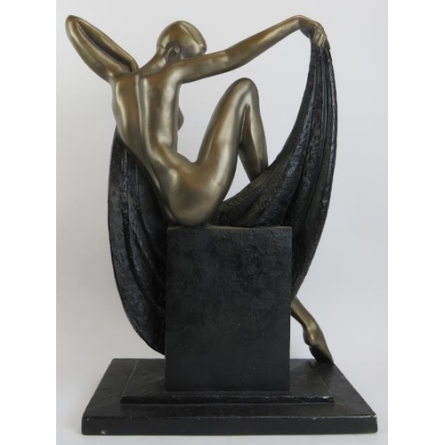 78 - A large Modern Art Deco style cast and painted metal figure of a reclining nude woman manufactured b... 