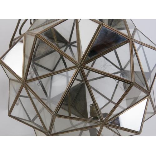 81 - A large multifaceted glass polyhedron ceiling light, 20th century. Composed of clear and mirrored tr... 