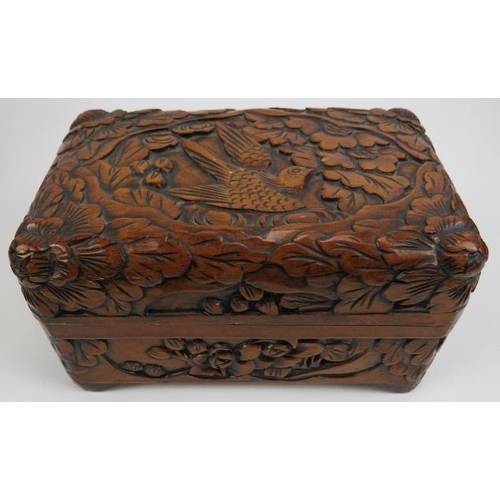 88 - Four Chinese carved wood boxes, 20th century. Comprising three graduated boxes carved depicting bird... 