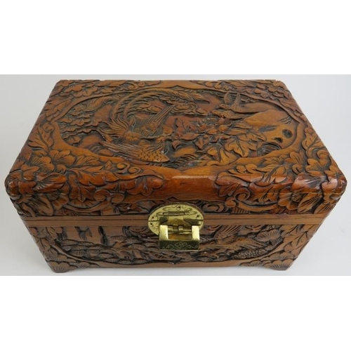 88 - Four Chinese carved wood boxes, 20th century. Comprising three graduated boxes carved depicting bird... 