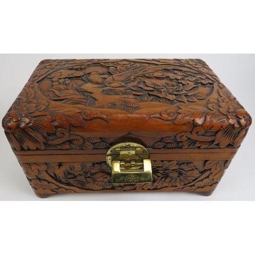 88 - Four Chinese carved wood boxes, 20th century. Comprising three graduated boxes carved depicting bird... 