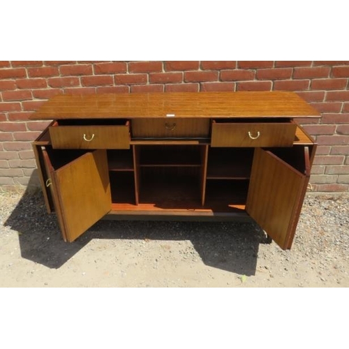 704 - A mid-century teak ‘Librenza’ sideboard by G Plan, housing three short drawers above bi-folding cupb... 