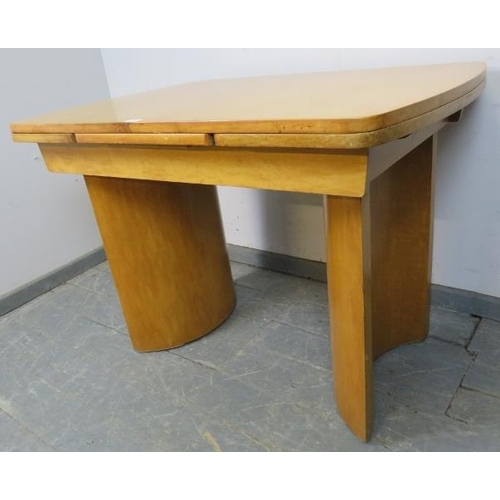 708 - An Art Deco Period bird’s eye maple draw-leaf extending dining table, on curved supports. 
H77cm W10... 