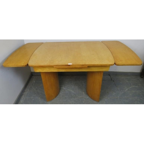 708 - An Art Deco Period bird’s eye maple draw-leaf extending dining table, on curved supports. 
H77cm W10... 