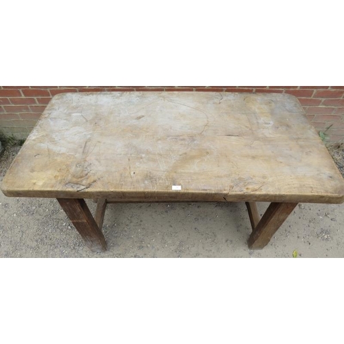 712 - A substantial 19th century elm kitchen/pantry table on chamfered square end supports with stretchers... 