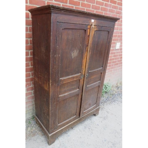 713 - An 18th century pine bacon/pantry cupboard, the panelled doors opening onto hanging rails above two ... 