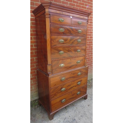 717 - A good Regency Period mahogany chest on chest, the cornice with batwing and parquetry inlay, above t... 