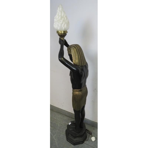 718 - A vintage bronzed floor-standing lamp in the form of an Egyptian Pharaoh holding a torch aloft.
H154... 