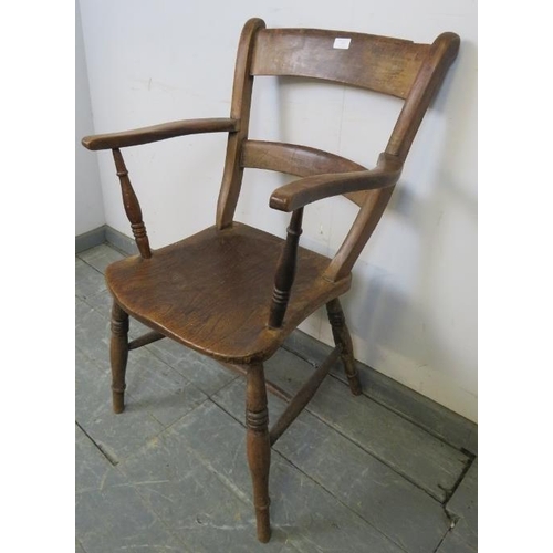 727 - A 19th century elm and beech ‘Oxford’ elbow chair, on canted turned supports with an ‘H’ stretcher. ... 