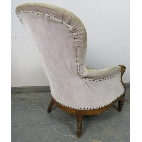 728 - A Victorian walnut armchair upholstered in buttoned grey velvet material, on tapering supports. 
H98... 