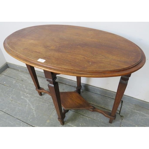 732 - An Arts & Crafts oak and mahogany oval occasional table, on tapering square supports united by a dia... 