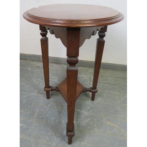 732 - An Arts & Crafts oak and mahogany oval occasional table, on tapering square supports united by a dia... 