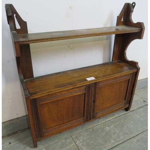 738 - An Edwardian mahogany wall hanging shelf, with cupboard under.
H60cm W59cm D16cm (approx).
Condition... 