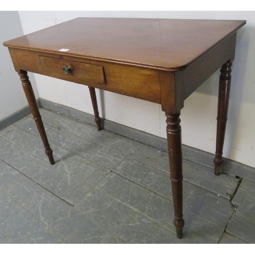 740 - A late Georgian mahogany side table, the single drawer with pressed brass handle, on tapering turned... 