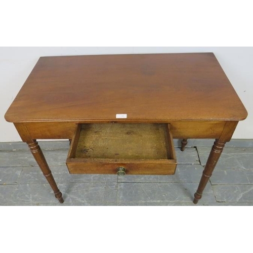 740 - A late Georgian mahogany side table, the single drawer with pressed brass handle, on tapering turned... 