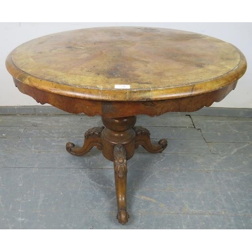 741 - A Victorian walnut tilt-top supper table by W. Priest of Blackfriars, on a bulbous turned column ter... 