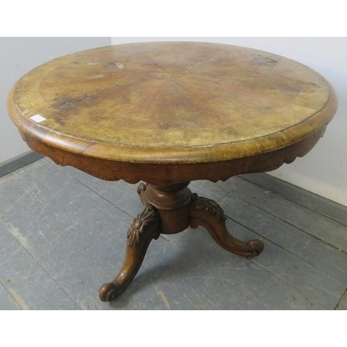 741 - A Victorian walnut tilt-top supper table by W. Priest of Blackfriars, on a bulbous turned column ter... 