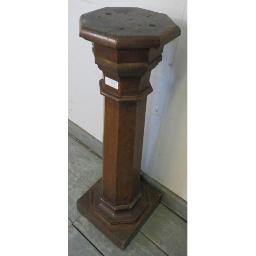 749 - A 19th century oak octagonal upcycled torchere, on a plinth base. 
H76cm W24cm D24cm (approx).
Condi... 