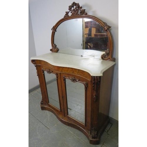 751 - A Victorian walnut serpentine fronted chiffonier, the mirror back with foliate carved cornice and sp... 