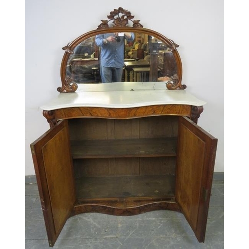 751 - A Victorian walnut serpentine fronted chiffonier, the mirror back with foliate carved cornice and sp... 