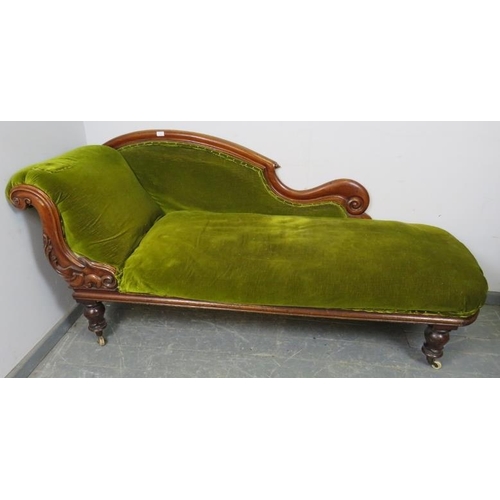 761 - A Victorian mahogany show-wood chaise longue, with scrolled backrest and carved acanthus leaf decora... 