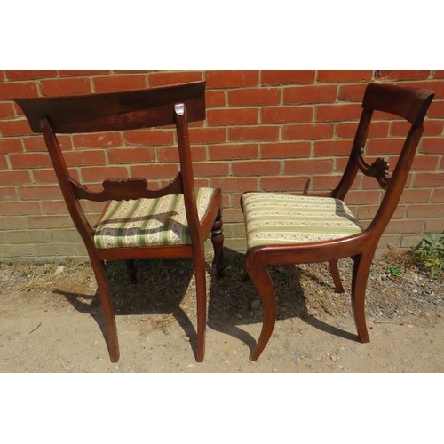 822 - A set of six 19th century mahogany sabre leg dining chairs and two similar chairs with turned front ... 