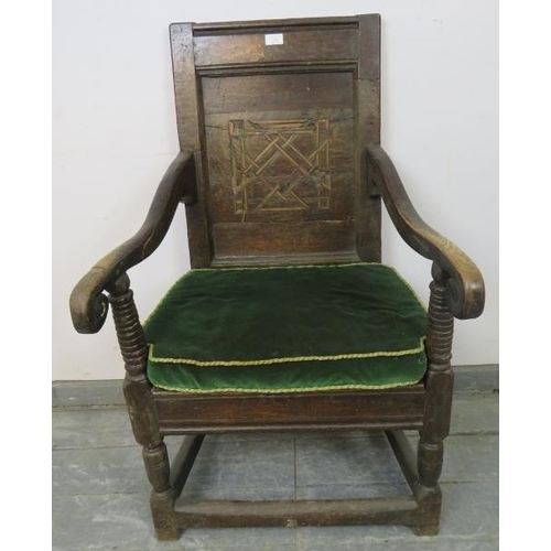 826 - A 17th century oak Wainscot chair with walnut parquetry back panel, joined with scrolled arms to a d... 