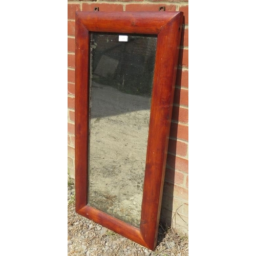 829 - An antique rectangular wall mirror in a pitch pine surround with nicely silvered plate. 
H102cm W48c... 