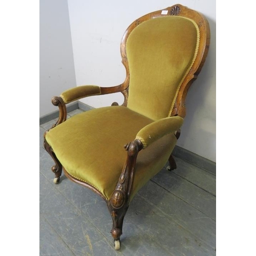 832 - A Victorian walnut open-sided armchair with scrolled arms, upholstered in mustard velvet material, o... 