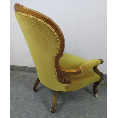 832 - A Victorian walnut open-sided armchair with scrolled arms, upholstered in mustard velvet material, o... 