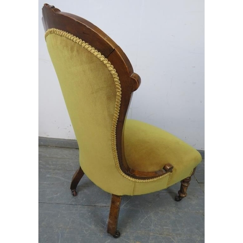 833 - A Victorian walnut spoon-back bedroom chair, upholstered in buttoned mustard velvet material, on tap... 