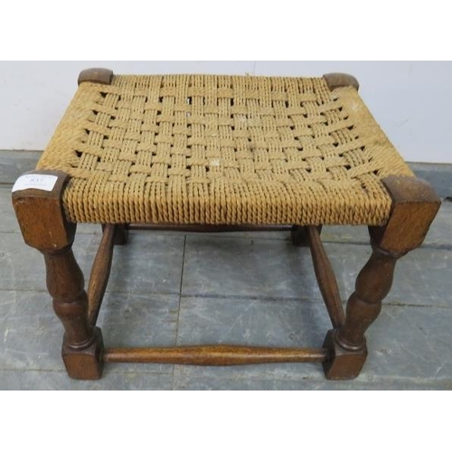 837 - An antique oak stool, with braided rope seat, on turned and block supports with stretchers. 
H30cm W... 