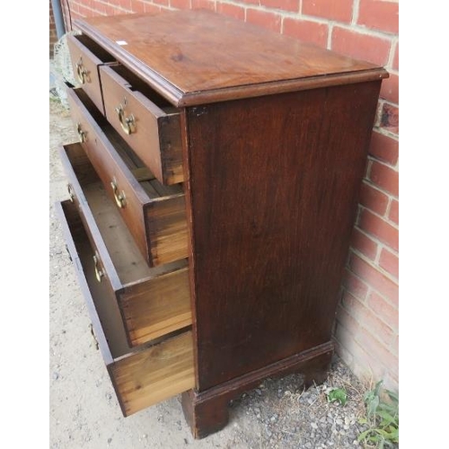 844 - A Georgian mahogany straight-front chest of two short over three long graduated drawers with brass s... 