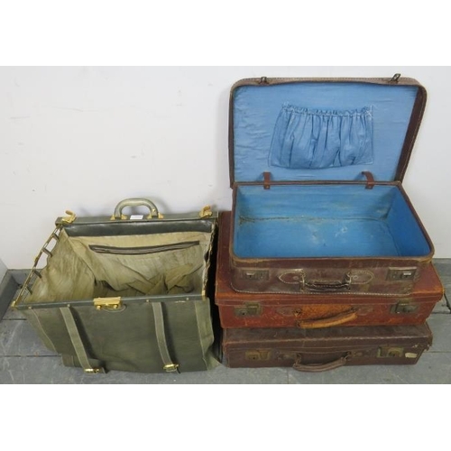 856 - Three vintage leather suitcases, together with a London maker vintage leather doctor’s bag with bras... 