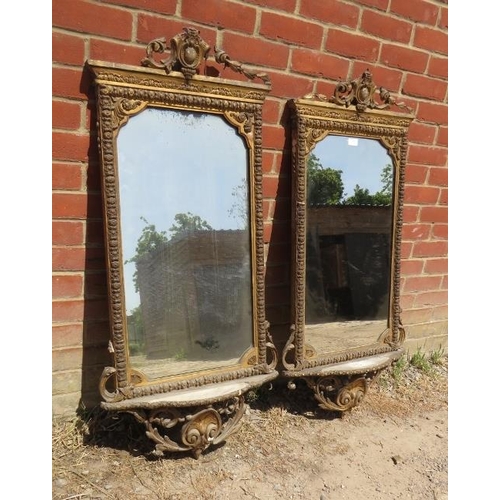 869 - A pair of 19th century Italian gilt gesso wall mirrors in ornate surrounds depicting scrolling acant... 