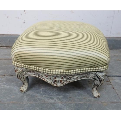 873 - A small Victorian footstool, upholstered in period style striped material, the carved base painted d... 