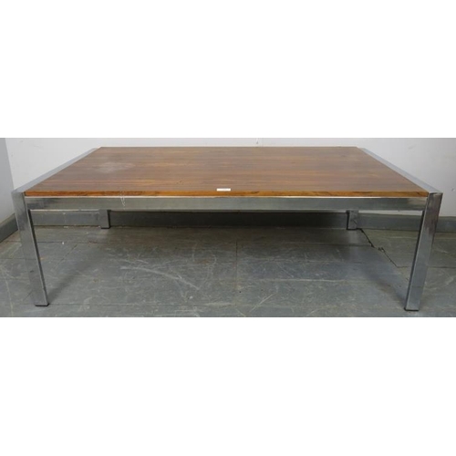 876 - A mid-century rosewood and chrome coffee table in the manner of Merrow Associates, on chrome support... 