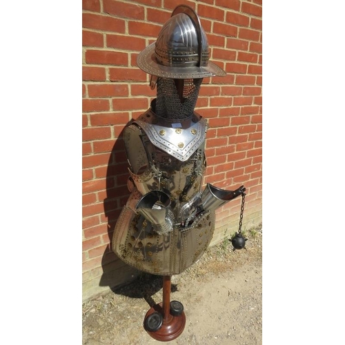 879 - A life-size replica 15th century Spanish style suit of armour in steel and brass, on a turned hardwo... 