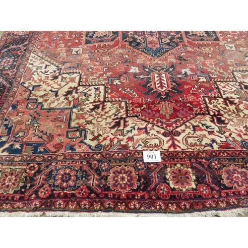 901 - A good quality mid 20th century Persian carpet central star burst motif, on pale red ground with dee... 