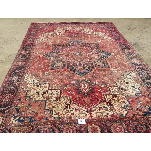 901 - A good quality mid 20th century Persian carpet central star burst motif, on pale red ground with dee... 