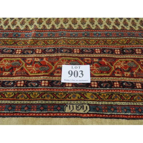 903 - A 20th century Persian rug with central block pattern on cream ground. Condition and colour good. 31... 