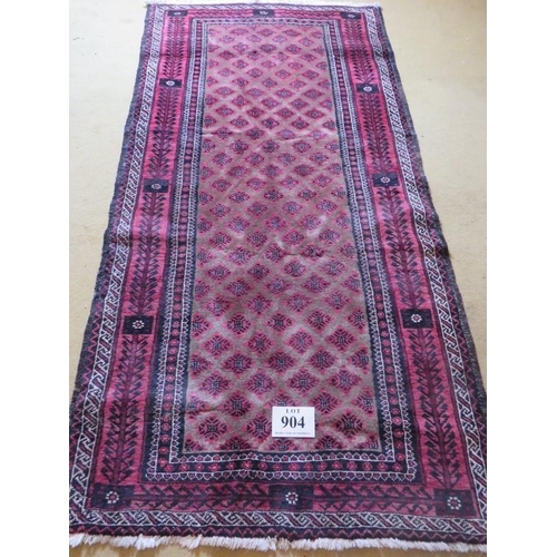 904 - A mid 20th century meshed Baluch rug with rare overall pattern on mellow camel field and abstract tr... 