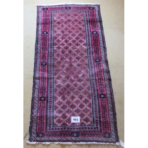 904 - A mid 20th century meshed Baluch rug with rare overall pattern on mellow camel field and abstract tr... 