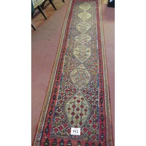 912 - A good North West Persian Senneh Kilim runner, 7 central panels on a patterned ground and in good co... 