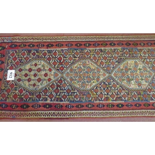 912 - A good North West Persian Senneh Kilim runner, 7 central panels on a patterned ground and in good co... 