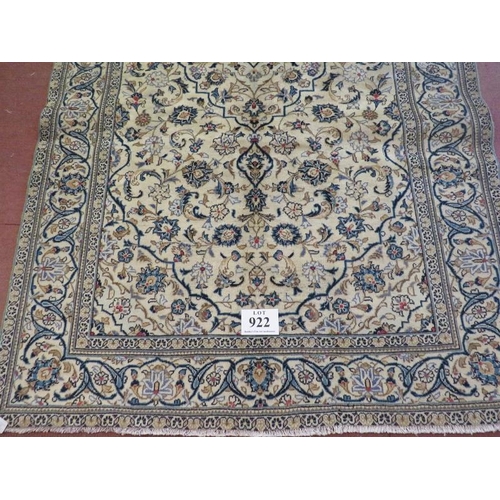 922 - A Persian Yazd carpet cream ground with heavy floral motifs and in good condition. 250 x 150.