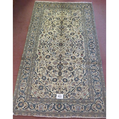 922 - A Persian Yazd carpet cream ground with heavy floral motifs and in good condition. 250 x 150.